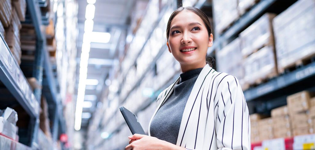 Woman reviewing inventory on tablet