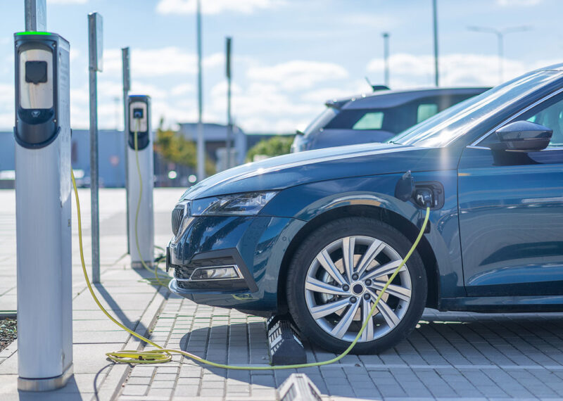 Electric car charging at a station